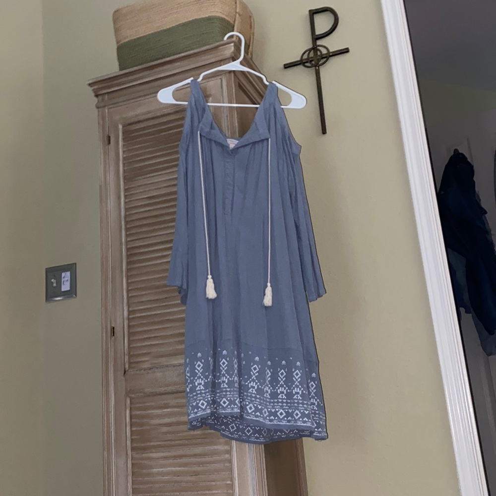 Light blue open shoulder dress with tassels